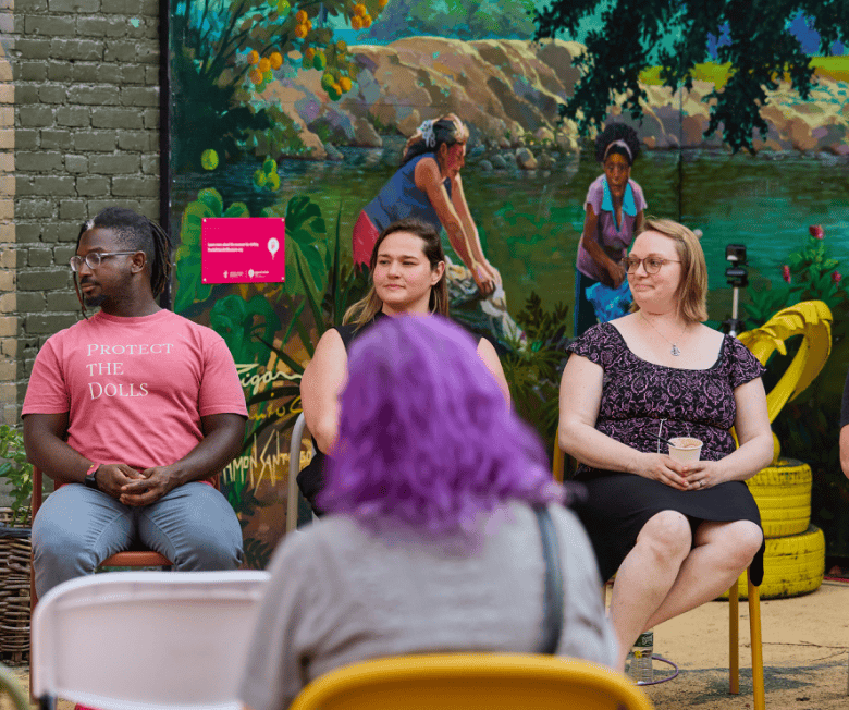 professional therapist at event | teen counselor lynn, ma | teen therapy lynn, ma | teen counseling lynn, ma | lynn, ma | winthrop, ma | saugus, ma A group of professionals sitting in chairs in front of a mural at an event. Teen therapy in Lynn, MA is here to support your child with anxiety, depression, transitions & more. Reach out today.