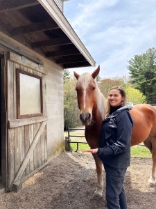 Jay standing with horse | lgbtqia+ therapy lynn, ma | lgbtqia affirming therapist lynn, ma | lgbtq therapy lynn, ma | lgbtq therapist lynn, ma | lynn, ma | swampscott, ma | Winthrop, MA Jay smiling & standing near a horse in a pasture. Our team of therapists offer LGBTQIA+ individual therapy in Lynn, MA. Start your healing journey today.